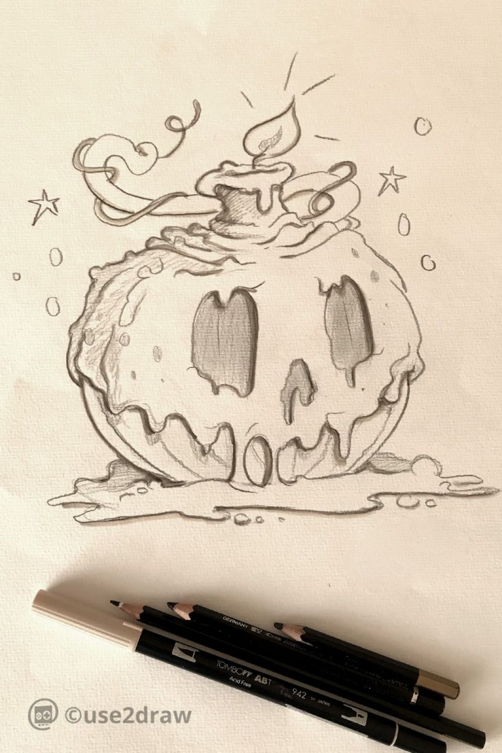 Halloween pumpkin with candle wax sketch as a basis for later