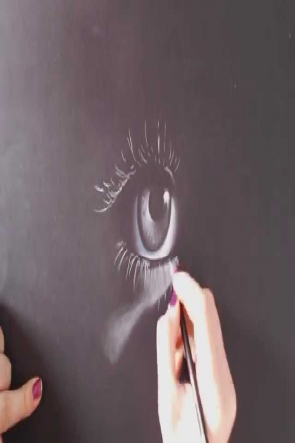 Eye on black paper