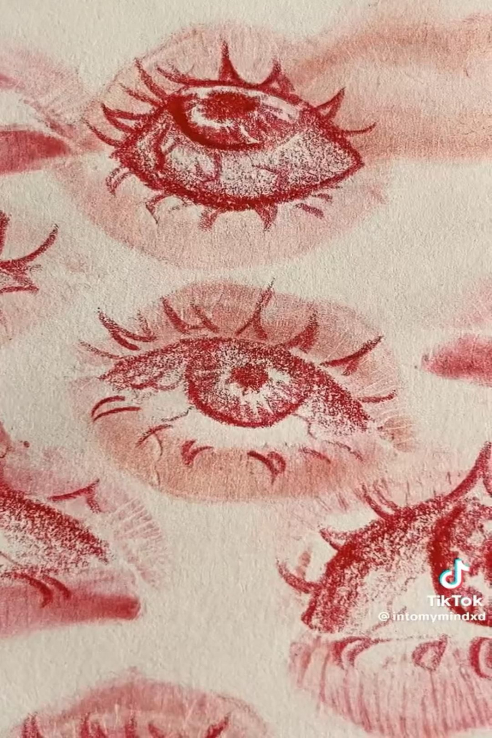 sketchbook drawing: eyes from lipstick kiss prints in   Eye