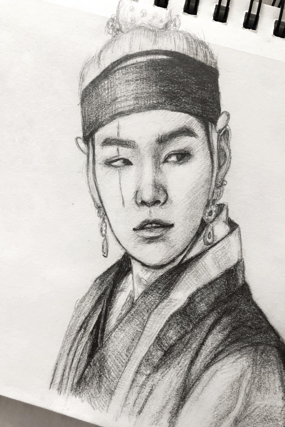 Yoongi with long hair, dressed in Feudal Korea robes, while